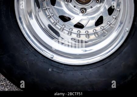 racing wheel. chrome wheel of a racing car. car racing concept. shabby racing tire Stock Photo