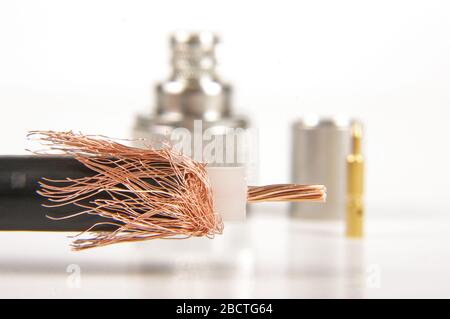 Half prepared for crimping coaxial cable and N type connector in the background Stock Photo