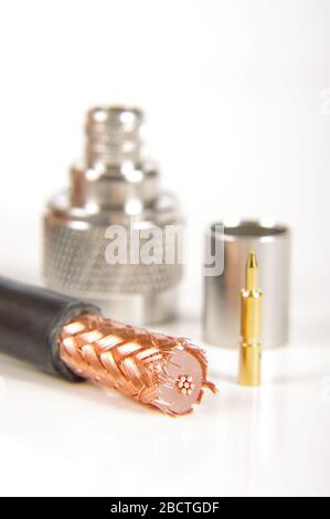 Half prepared for crimping coaxial cable and N type connector in the background Stock Photo