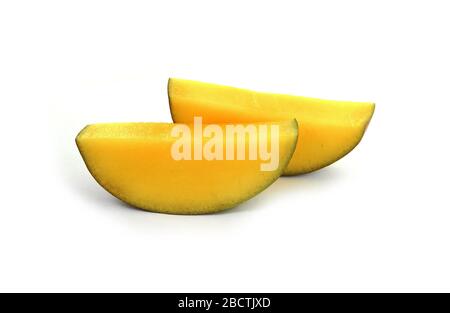 Juicy dessert mango isolated on white background. Sweet Mango slices. Stock Photo