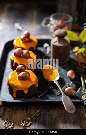 Easter cupcakes covered in icing and decorated with chocolate eggs.Healthy food and drink Stock Photo