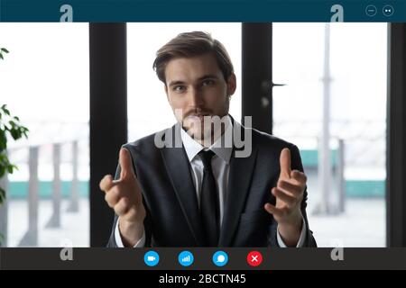 Laptop screen view businessman makes videocall negotiating with investors distantly Stock Photo