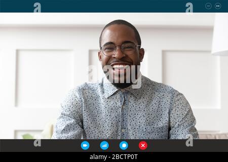 Guy chatting with friend looking at webcam laptop screen view Stock Photo