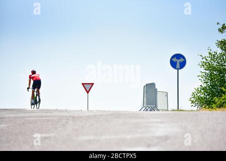 Cyclist silhouette on the road race Stock Photo