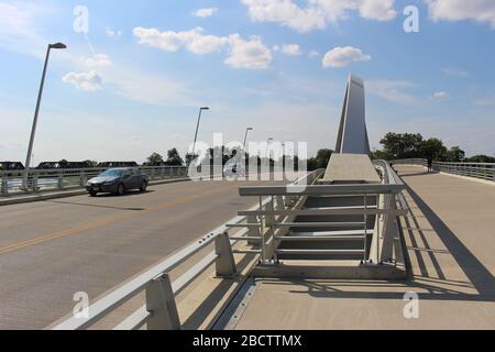 Alexander park Downtown Columbus Ohio green landscape with green trees, concrete walk way , colorful trees city skyline structure ,blue sky Stock Photo