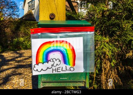 Child's picture of a rainbow in a Woking street as people try to stay positive isolated in their homes during the coronavirus outbreak and lockdown Stock Photo