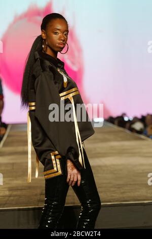 Montreal,Canada.  A model poses on the runway at the Canadian designers fashion show held during the Fashion and Design Festival. Stock Photo