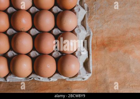 Eggs in carton box on rustic background, bogota colombia, april 4, 2020 Stock Photo