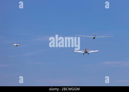 Gliders Launching behind tow aircraft Stock Photo