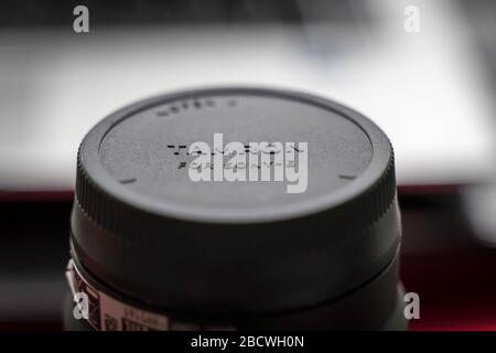 London, UK - January 10, 2020 - cap from Tamron lens with logo on it Stock Photo