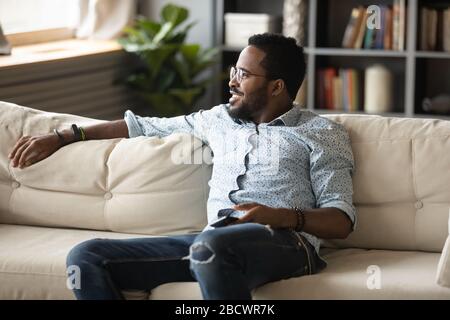 Dreamy biracial man look in distance thinking or visualizing Stock Photo