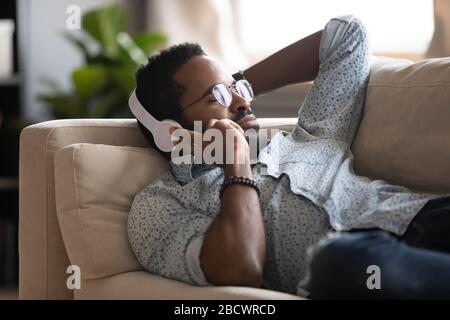 African American man enjoy music in wireless headphones Stock Photo