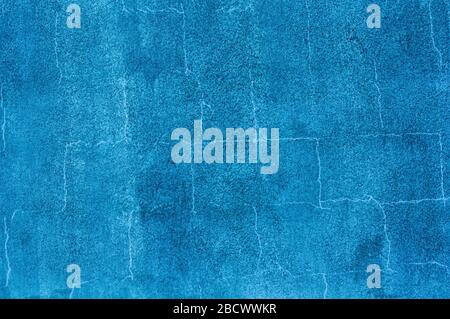 Dark blue colored grunge textured wall to use as background for other graphic projects Stock Photo