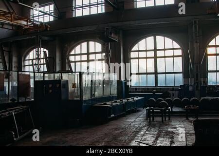 Old abandoned railroad workshop. Train repairing factory with old machinery Stock Photo