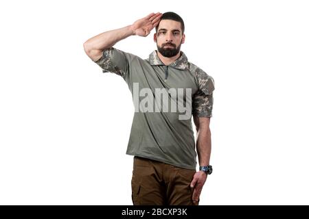 Portrait of Young Soldier Salutes on a White Background Stock Photo