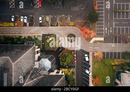 Top down drone shoot over car park at hazy autumnal morning in United Kingdom Stock Photo