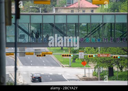 Austin, Texas, USA. 05th Apr, 2020. A person has a temperature check at an entry station on a footbridge before entering Dell Seton Medical Center at the University of Texas in Austin, Texas. Mario Cantu/CSM/Alamy Live News Stock Photo
