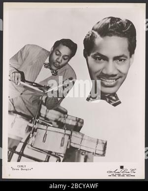 Gelatin silver print of Curly Drum Boogie. A black and white collaged promotional photograph of Curly 'Drum Boogie,' a member of the Lionel Hampton orchestra.The print features two black and white images of Curly 'Drum Boogie.' On the left side of the print he is depicted seated behind a drum set, with both drumsticks poi Gelatin silver print of Curly Drum Boogie Stock Photo