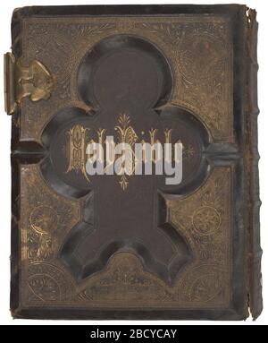 The Holy Bible Containing the Old and New Testaments. Shearer family illustrated bible with leather hardcover binding, and ornate metallic recessed design with metal clasp enclosures. The Holy Bible Containing the Old and New Testaments Stock Photo