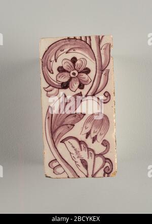 Tile. Research in ProgressVertical rectangles. Each tile with identical pattern of two flowers and leaves on continuous scrolling stem. One flower faces the observer and the other is in profile. Manganese violet on white ground. Tile Stock Photo