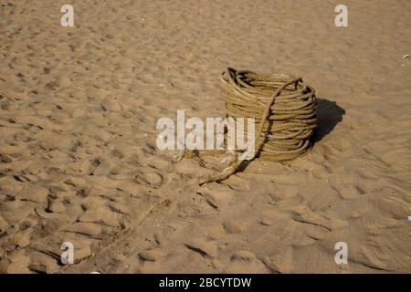 Bunch of fishing rope on beach sand - using fishing rope Stock Photo