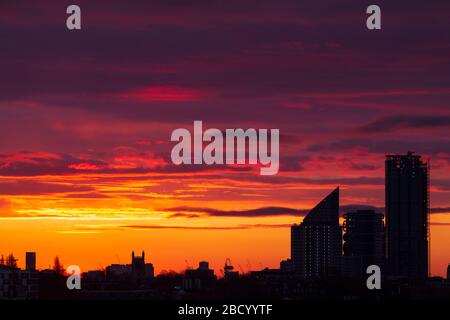 London, UK. 06th Apr, 2020. Blazing sunrise over London looking East towards the Queen Elizabeth II Olympic Park Stratford. Credit: Thamesfleet/Alamy Live News Stock Photo