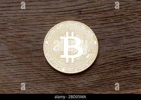 Digital currency physical gold bitcoin on the wood. Stock Photo