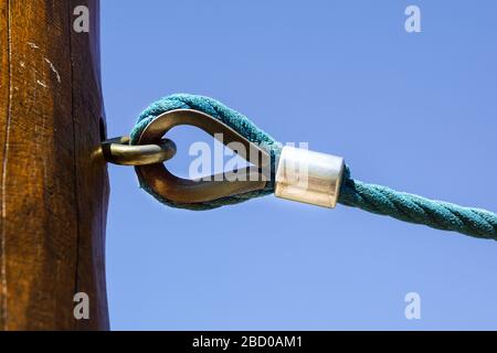 rusty shackle connect the sling and rope tied knot Stock Photo