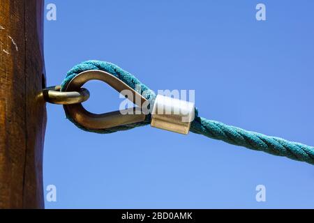 rusty shackle connect the sling and rope tied knot Stock Photo