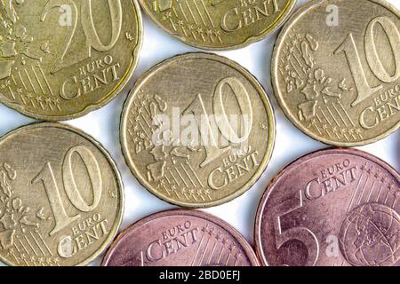 Euro cents in denominations of 5, 10 and 20 are isolated on a white background. close-up. flat lay Stock Photo