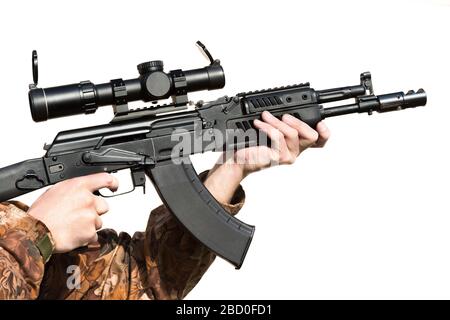 A man is holding a rifle magazine camouflage clothes Stock Photo