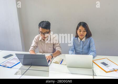 Two office employee working in the office Stock Photo