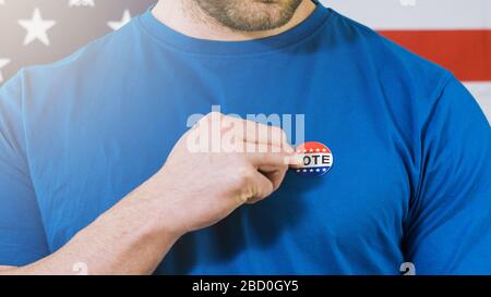 Man putting on Vote sticker for Presidential election 2020 in America. Stock Photo