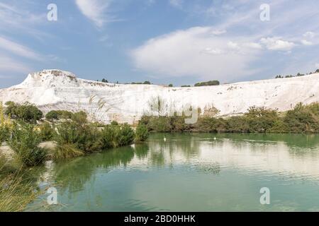 Natural travertine pools and terraces view from Pamukkale, Denizli, Turkey. Stock Photo