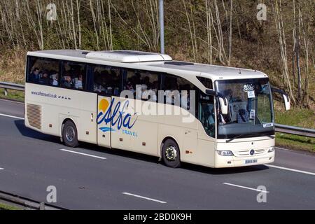 Alfa coach travel; National Express is a intercity and Inter-regional coach operator driving Mercedes Benz on the M6 Motorway, UK Stock Photo