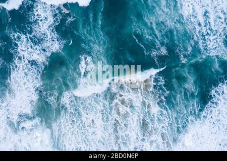 Blue ocean waves and sand aerial drone top view Stock Photo