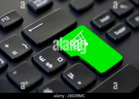 Shopping cart icon on a computer keyboard, online shopping and delivery concept Stock Photo