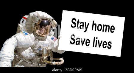 Astronaut in space holding a  board with the message Stay home, save lives - elements of this image are provided by NASA Stock Photo