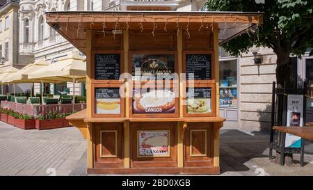 A stall selling langos hot dog and pancake in Győr on Baross Road. Stock Photo