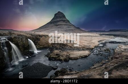 Northern lights aurora borealis over kirkjufell waterfall in Iceland Stock Photo