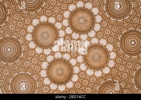 Beautiful ceiling with carved plaster decoration. Architectural detail from the mosque Hassan II in Casablanca, Morocco. Stock Photo