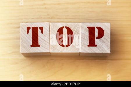 Top word made on wooden cubes. Business or personal achievements concept Stock Photo