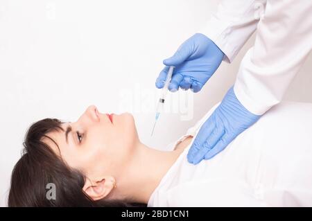 doctor does a biopsy on a thyroid gland for cancer cells, copy space, inflammation Stock Photo