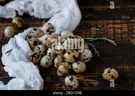 Quail eggs on wooden background. Symbol of the Easter season. Healthy Eating. Stock Photo
