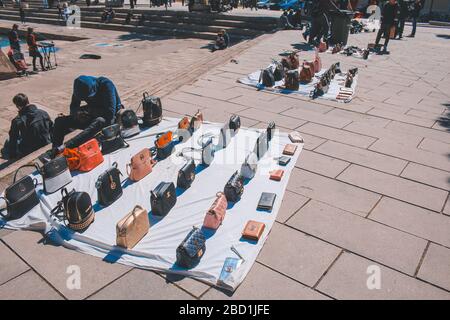 Palma, Mallorca / Spain - March 26 2018: Men selling fake handbags at Parc de la mar  located in the capital Palma de Mallorca Stock Photo