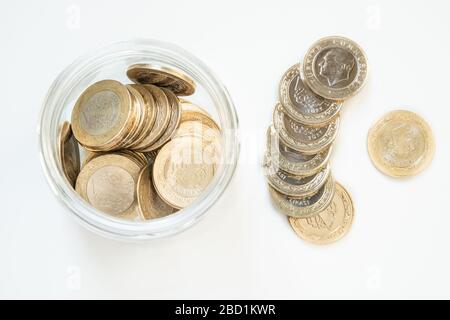 Top view of 1 Turkish Lira (TRY) coins in a jar on isolated on white background. Money growth and deposit accumulation concept. Stock Photo