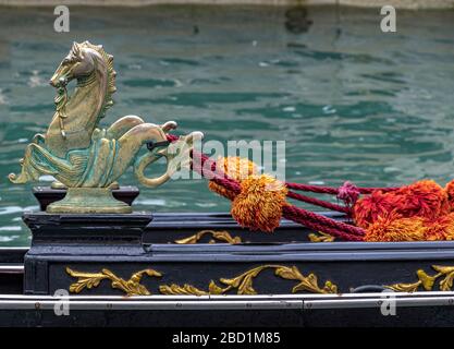 Close up of  a golden seahorse ornaments on the side of  a Venetian  gondola Gondolas on The Grand Canal ,Venice,Italy Stock Photo