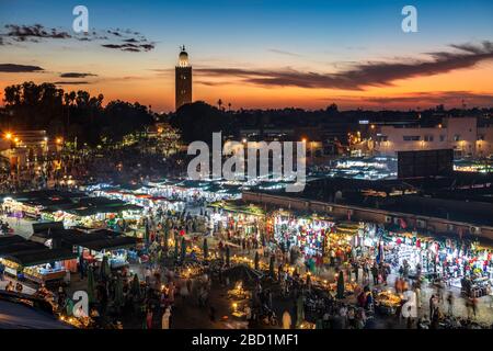 View over the Djemaa el Fna at dusk showing food stalls and crowds of people, Marrakech, Morocco, North Africa, Africa Stock Photo