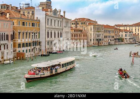 A route No 2  Vaporetto or water bus packed with passengers near Accademia on The Grand Canal in Venice,Italy Stock Photo