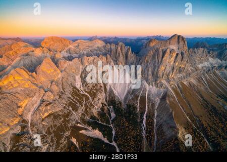 Aerial view of autumn sunset over Torri Del Vajolet, Catinaccio Group and Roda di Vael, Dolomites, South Tyrol, Italy, Europe Stock Photo